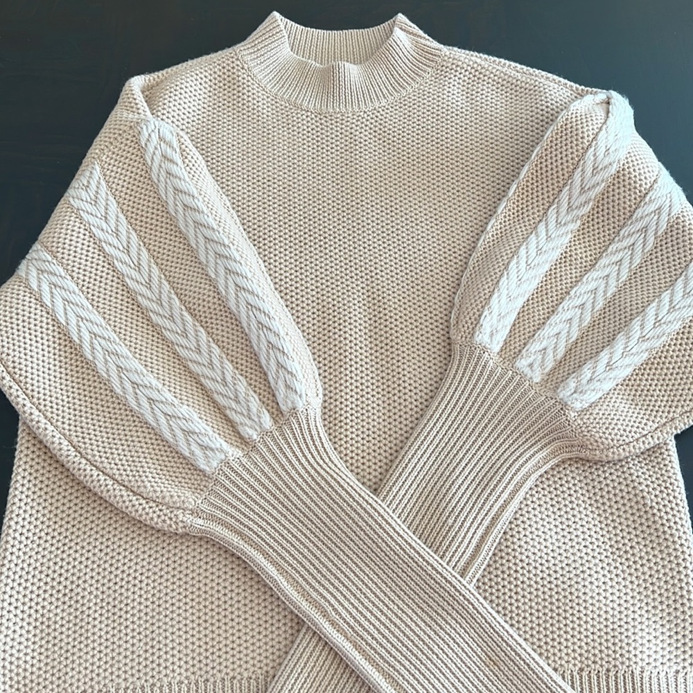 Puffy sleeves very natural color ,100% wool.